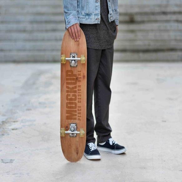 Teenager With Mock Up Skateboard Outdoors